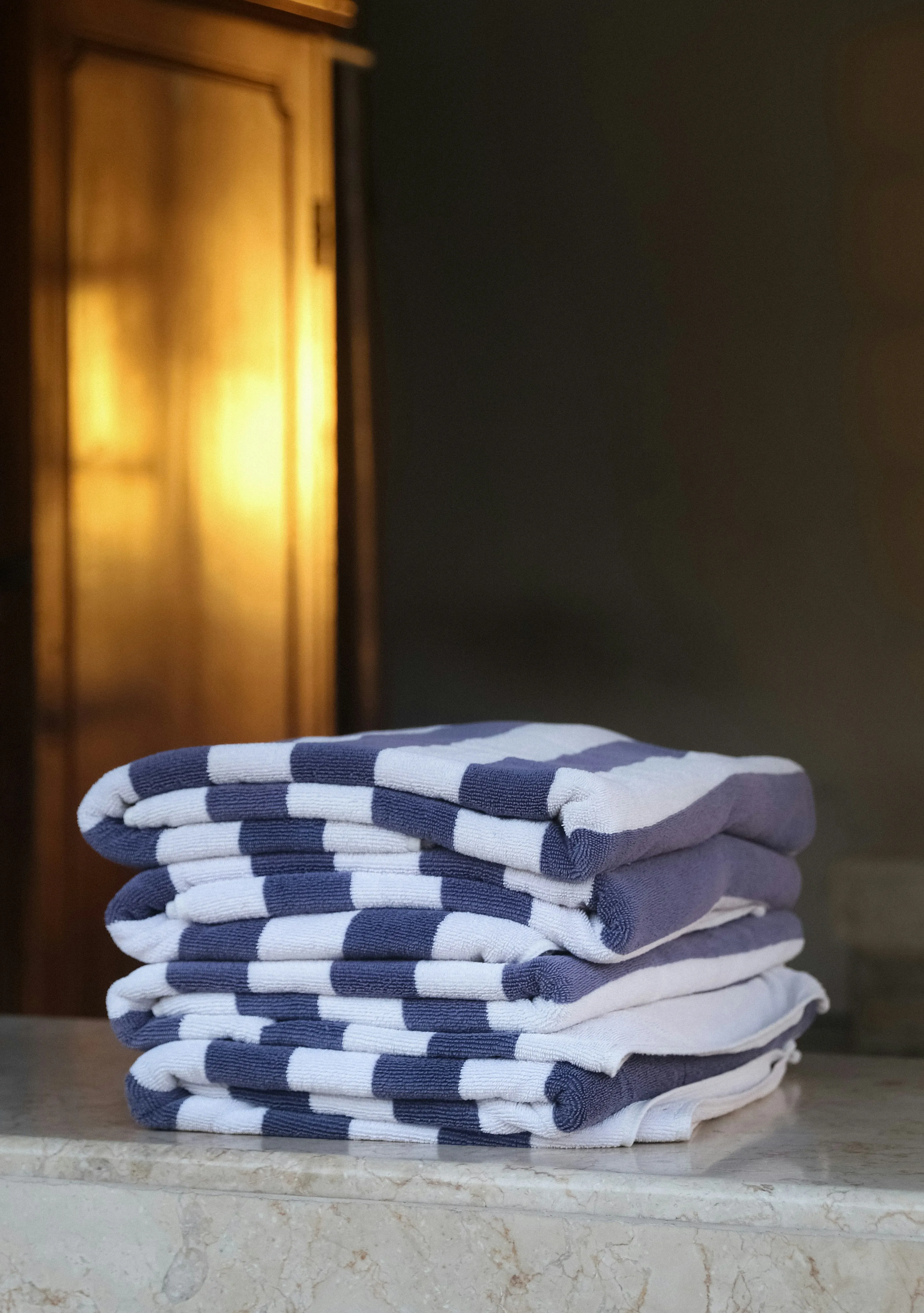 A stack of freshly folded striped towels
